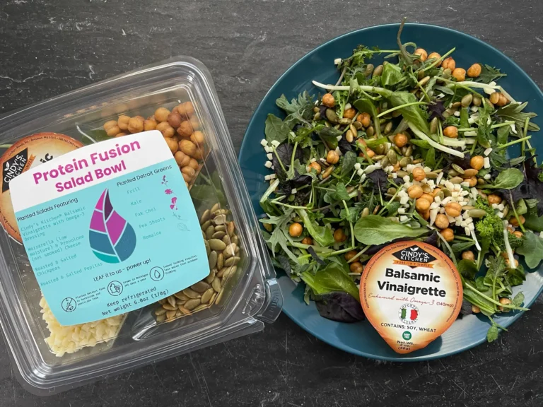 Mediterranean-style pearled couscous salad topped with fresh broccoli microgreens for flavor and nutrition.